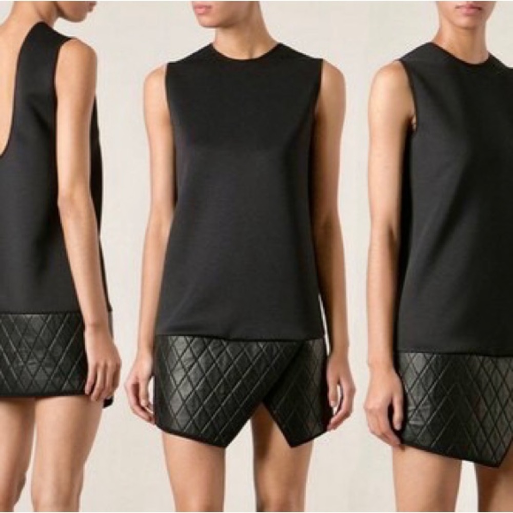 Neil Barrett structural/ asymmetrical woman’s black top. Sleek, vividly black.
